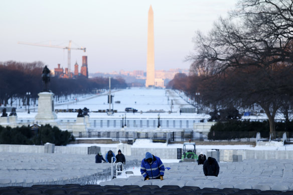 Folding chairs are set up during rehearsals for the inauguration on the West Front of the US Capitol.