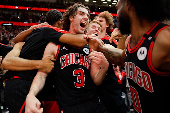 Josh Giddey celebrates with his Bulls teammates after hitting a stunning game-winning three-pointer against the Lakers.