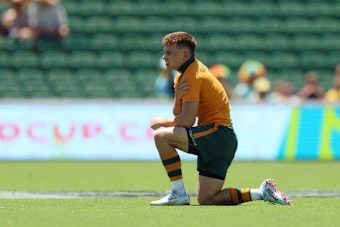 Australia’s William Cartwright leaves the field after being injured in the match against New Zealand.