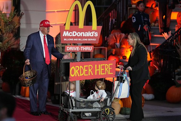 President Donald Trump was handing out Halloween chocolate to children within hours of arriving back in Washington from Asia.