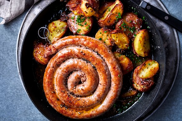 Lamb merguez sausage with sauerkraut, crushed potatoes and caraway butter.