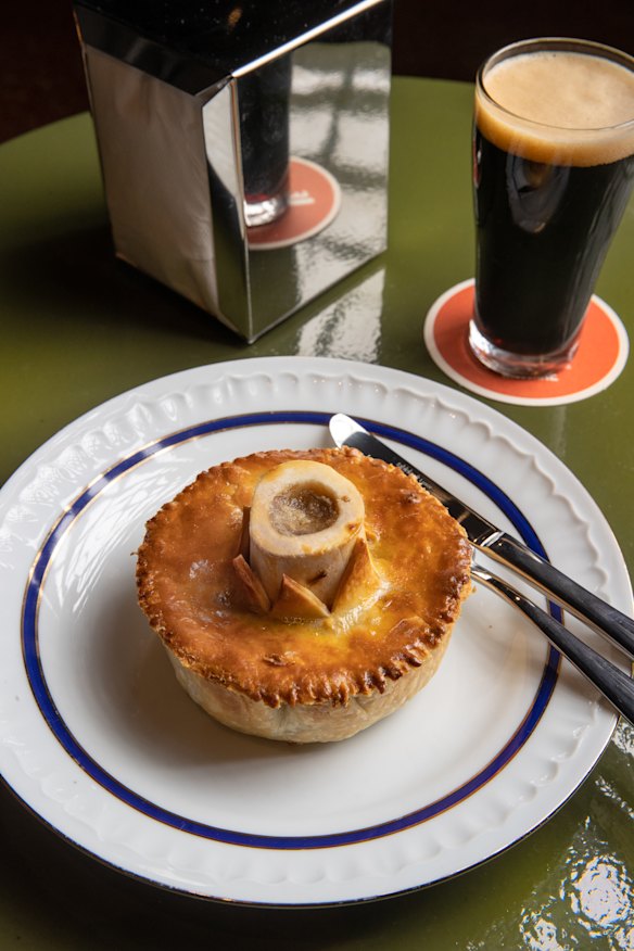 A marrow bone protrudes from the “stupidly rich” oxtail and snail pie.