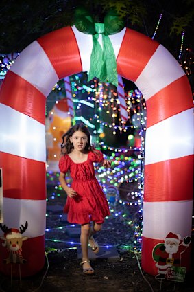 Zadie runs through an archway outside her Upwey home.