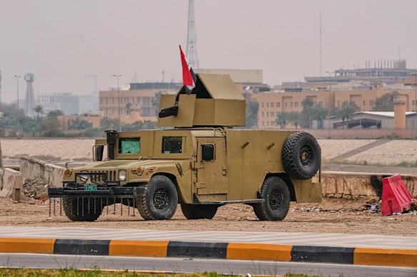 An Iraqi army armoured humvee vehicle is deployed near the banks of the Tigris River to protect the US embassy-fortified “green zone” in Baghdad.