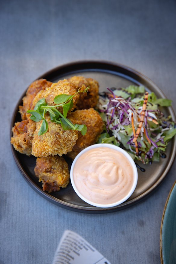 Bite-sized cauliflower, deep-fried and served with a side of sriracha mayo.