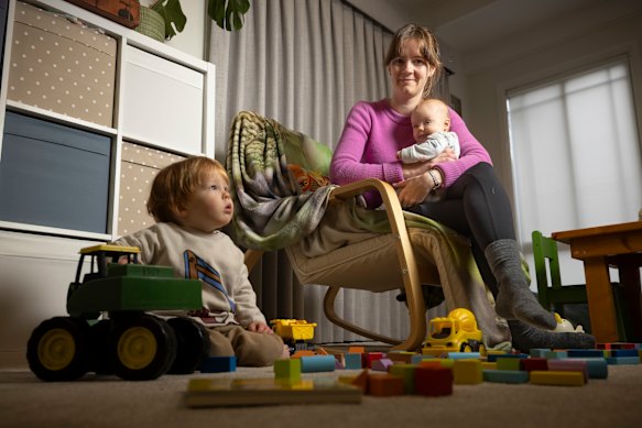 Anna Gilmore, pictured at home with her two children, is concerned about the stripped state funding for sleep programs.