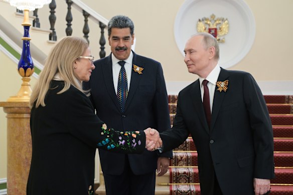Cilia Flores meets Russian President Vladimir Putin alongside her husband in Moscow last year.