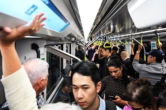 Commuters pack a CBD-bound metro train during the morning peak last week.