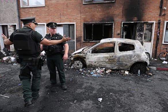 Police attend the scene of a clean-up on Lendrick Street in east Belfast.