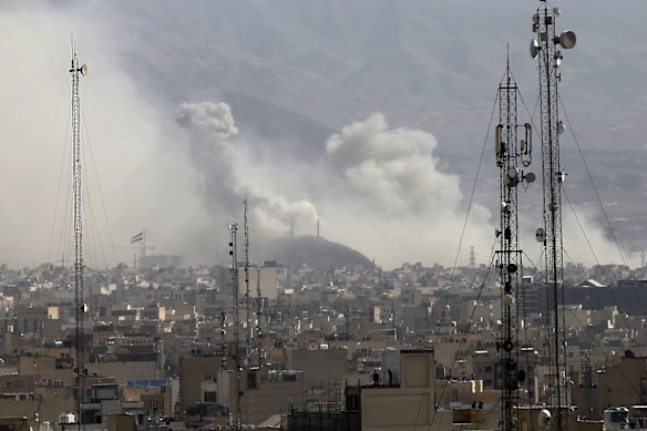 Smoke rises over Tehran&rsquo;s city centre after an Israeli army launches a second wave of airstrikes on Iran.