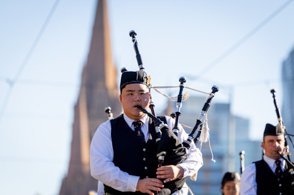 A piper pays his respects in Melbourne.