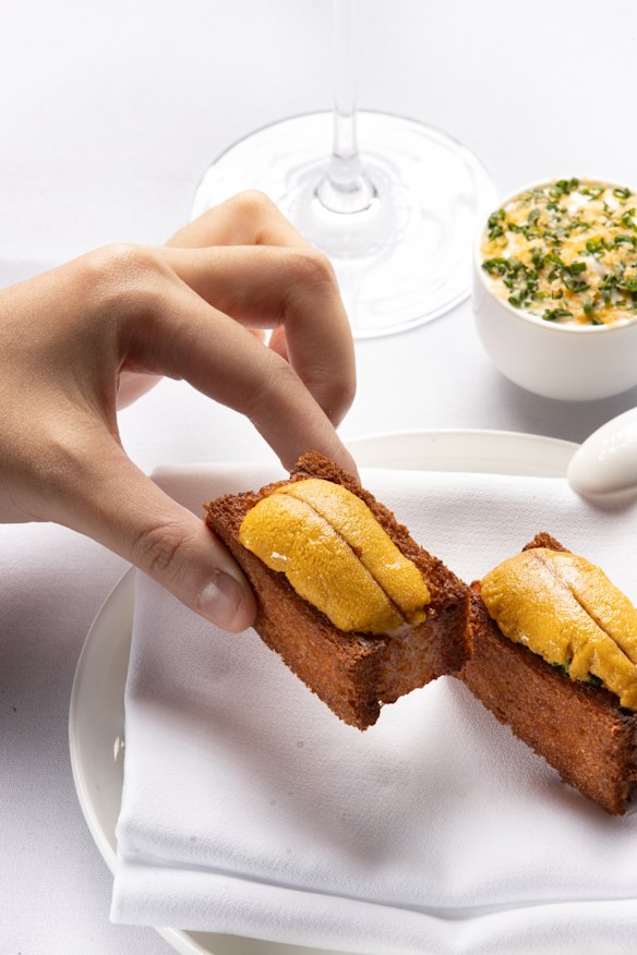 Lee Ho Fook’s prawn toast comes with luxurious touches, like a sea urchin on top.
