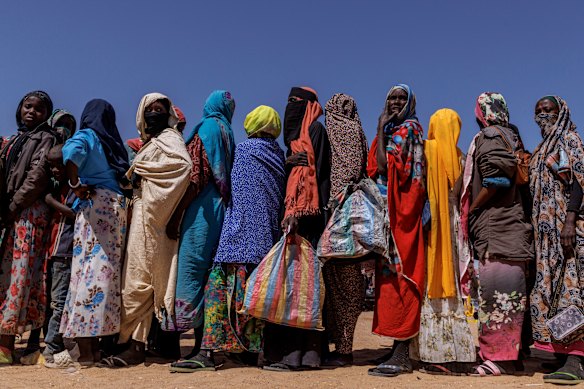 Sudanese refugees queue for biscuits at the Oure Cassoni refugee camp after arriving from Sudan in Oure Cassoni, Chad. In April 2023 civil war erupted between the Sudanese Armed Forces (SAF) and the armed militia group Rapid Support Forces (RSF). The ongoing conflict has so far displaced around 14 million people across the region, triggering a widespread humanitarian crisis, as neighboring countries like Chad struggle to absorb refugees, while coping with populations already suffering high poverty rates and food insecurity. 