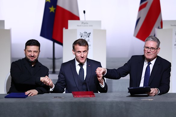 Volodymyr Zelensky President of Ukraine, Emmanuel Macron President of France and Keir Starmer Prime Minister of Great Britain attend a signing ceremony during the ‘Coalition Of The Willing’ meeting at Elysee Palace on January 6, 2026 in Paris, France.