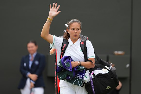 Daria Kasatkina waves as she leaves the court after losing to Liudmila Samsonova.