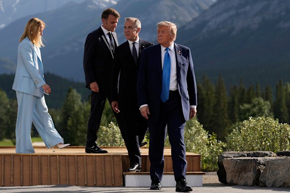 President Donald Trump, followed by Canadian Prime Minister Mark Carney, French President Emmanuel Macron and Italian Prime Minister Giorgia Meloni, leave the podium after their group photo at the G7 Summit in Canada last month.