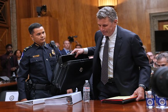 David Schertler, Anthony Fauci’s lawyer, is escorted out of the hearing room by security after being ejected by the Republican chairman.