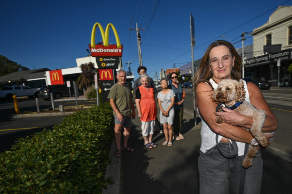 Mary Brest (front) with other Kew residents is trying to block a McDonald’s drive-through in Kew from going 24 hours.