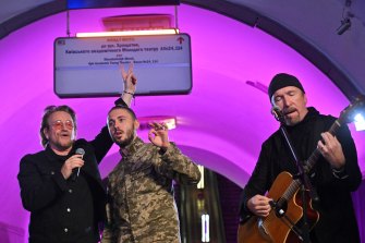 Irish singer-songwriter Bono with Taras Topolia, a Ukrainian band leader and now a serviceman in the Ukrainian Army, and guitarist The Edge perform at a metro station in Kyiv.