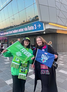 Sisters Emma and Danielle Bourke at the Super Netball grand final on Saturday night. 