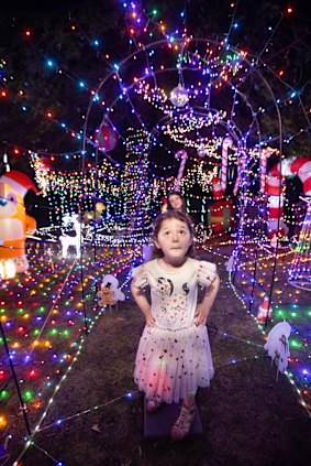 Pia explores her family’s Christmas display.