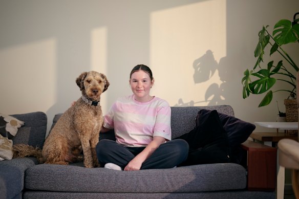 Maisie Mooney at home with her dog Milo. Her parents got her to delete TikTok after her daily screen usage soared from 30 minutes to three hours.