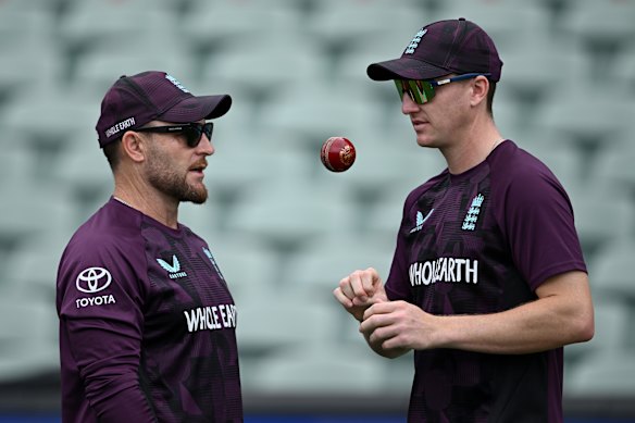 Harry Brook (right) touches base with England coach Brendon McCullum at training in Adelaide.