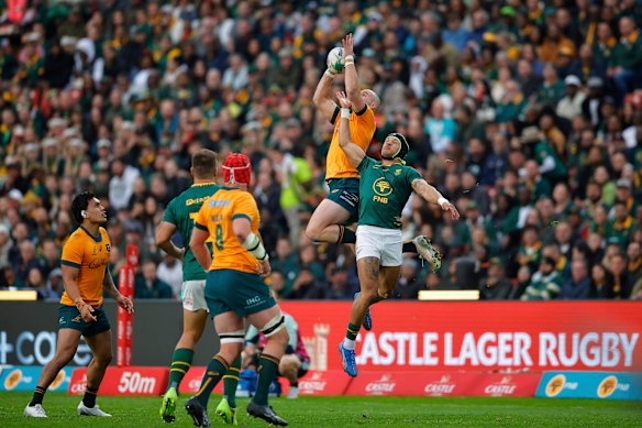 Australia’s Dylan Pietsch, top left, jumps for the ball during the match against the Springboks.