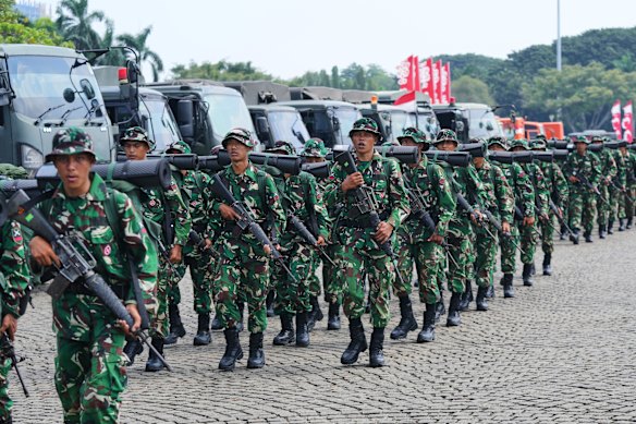 Soldiers are deployed in Jakarta on Monday after days of protests.