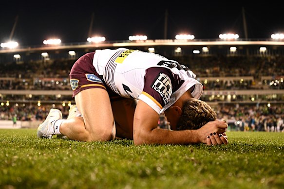 Reece Walsh slumps to the ground after Brisbane’s epic win.