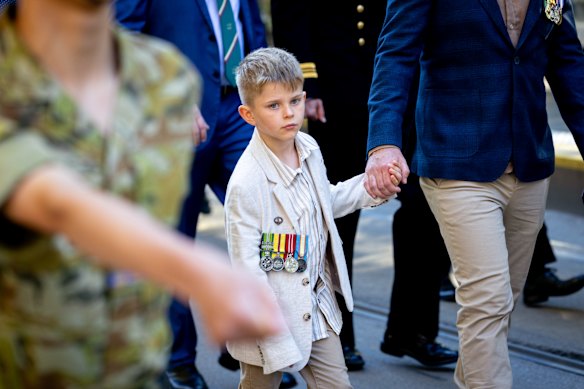 Young and old join hands to march through Melbourne.