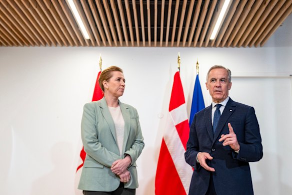 Canadian Prime Minister Mark Carney meets Danish leader Mette Frederiksen at the Canadian embassy in Paris on Tuesday.