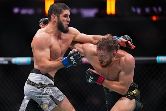 Islam Makhachev trades punches with Jack Della Maddalena in the UFC welterweight championship fight at Madison Square Garden on Saturday, local time.