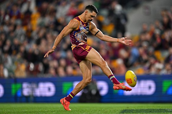 Charlie Cameron of the Lions kicks a goal.