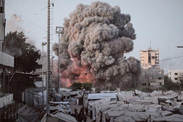 Smoke rises following an Israeli military strike in Gaza City on Tuesday.