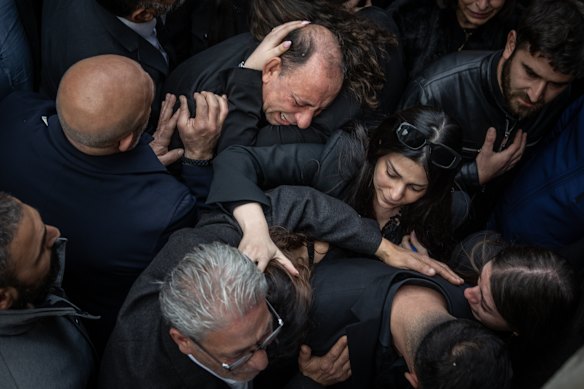 Family members grieve during the funeral service for Pierre Mouawad and his wife, who were killed in a drone strike at their home, in the Christian village of Yahshush on April 07, 2026 in Beirut, Lebanon. Israel has continued its aerial and ground assault in Lebanon after Hezbollah, the Iran-backed militant group in Lebanon, launched missiles at Israel in what it said was retaliation for the joint U.S.-Israeli war on Iran. 