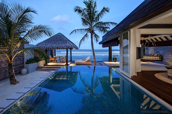 An Ocean House at Naladhu Private Island, Maldives has its own pool and deck with swing daybed.
