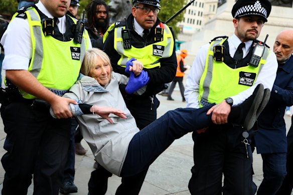 Police arrest a pro-Palestine protester in London on October 4.