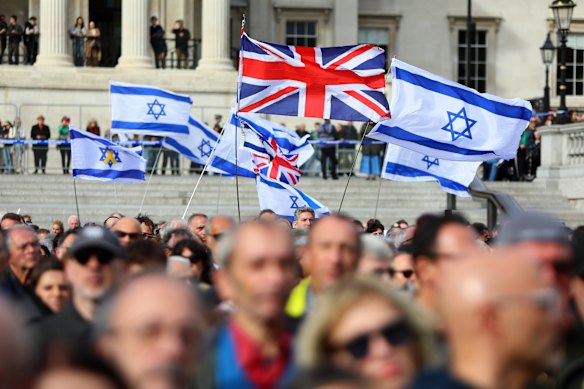 Britain’s Jewish community wave British and Israeli flags in London’s Trafalgar Square on Sunday.
