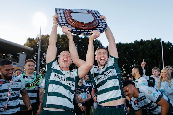 Warringah’s Bens – Woollett and Marr - celebrate their win over Eastern Suburbs.