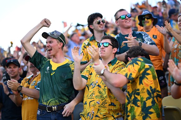Wallabies fans celebrate the match winning try  in Townsville.