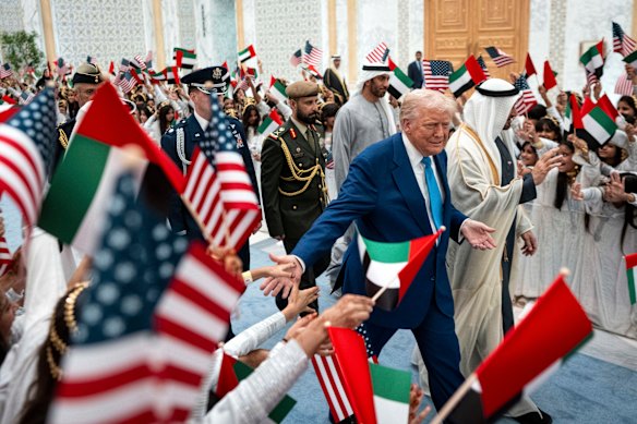 President Donald Trump is greeted by well-wishers are he arrives at Qasr Al Watan, the presidential palace, alongside President Mohammed bin Zayed Al Nahyan of the United Arab Emirates during his visit to Abu Dhabi on Thursday, May 15, 2025.  