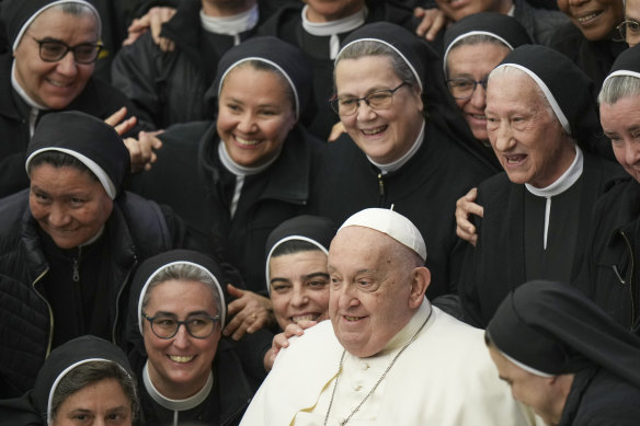 Posing for a photo with nuns on February 5.