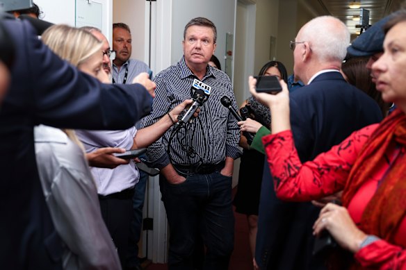 Senator Ross Cadell surrounded by journalists at Parliament House on Wednesday morning.