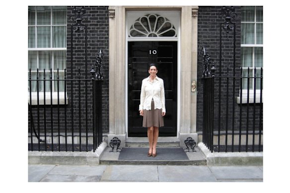 This undated photo released by the US Department of Justice shows Ghislaine Maxwell in front of 10 Downing Street in London.