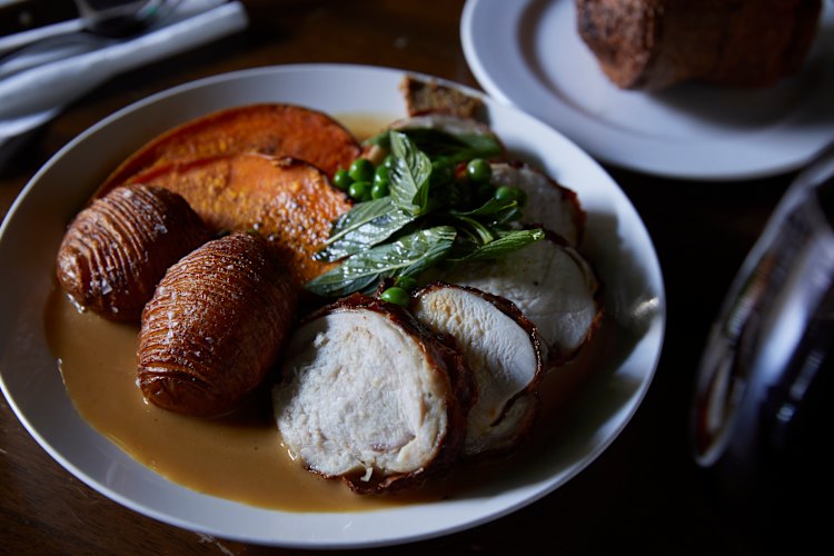 Sunday roast served with Hasselback spuds.