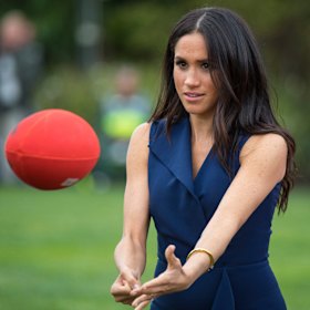 Meghan, the Duchess of Sussex, fires off a handball on a visit to Government House back in 2018.