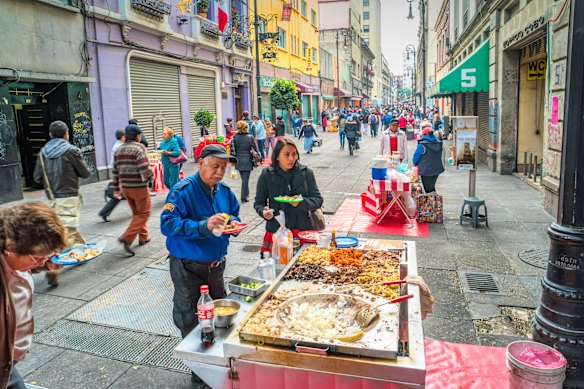 Mexico City offers endless choices of   street food, including tacos sold at this downtown stand. 