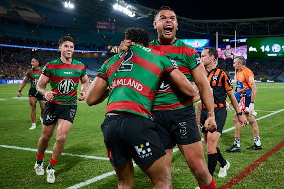Latrell Mitchell celebrates Isaiah Tass’s match-winning try.