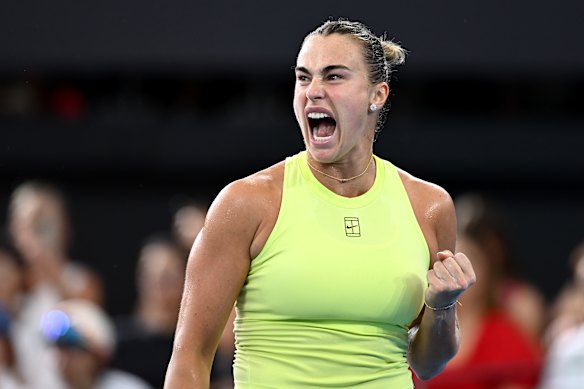Aryna Sabalenka celebrates winning a point against Marta Kostyuk.